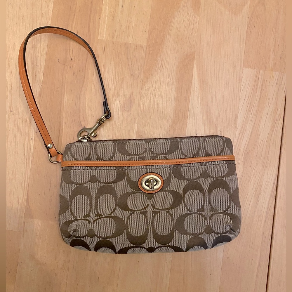 Cute Coach Wristlet with Orange leather accents! Good condition!